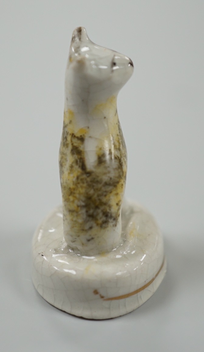 A seated toy Staffordshire model of a cat with tortoiseshell markings, c.1830-50. 4.5cm tall, Provenance: Dennis G.Rice collection